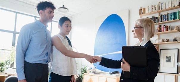 a therapist greeting clients and considering building trust online with client reviews